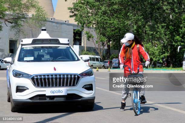 An Apollo Robotaxi runs at Shougang Park as Baidu launches China's first driverless taxi service in the city on May 2, 2021 in Beijing, China.