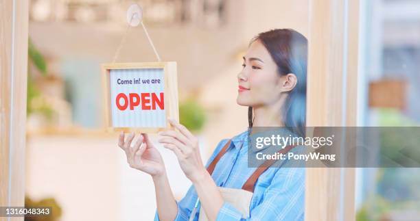 Shopkeeper Open Sign Photos and Premium High Res Pictures - Getty Images