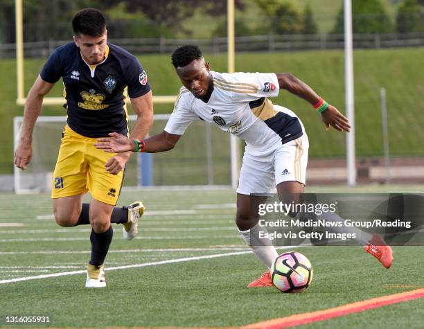 Euro's Leo Folla moves in on Reading's Mo Conde . The Reading United played host to the F.A. Euro New York at Exeter High School's Don Thomas Stadium...