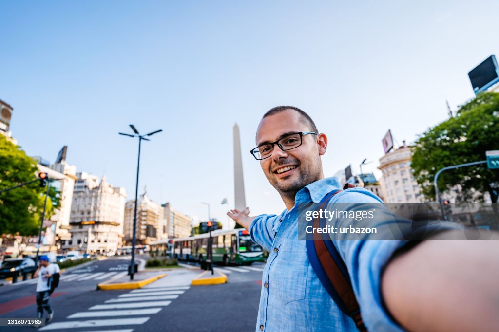 Man making selfie with obelisk from Buenos Aires
