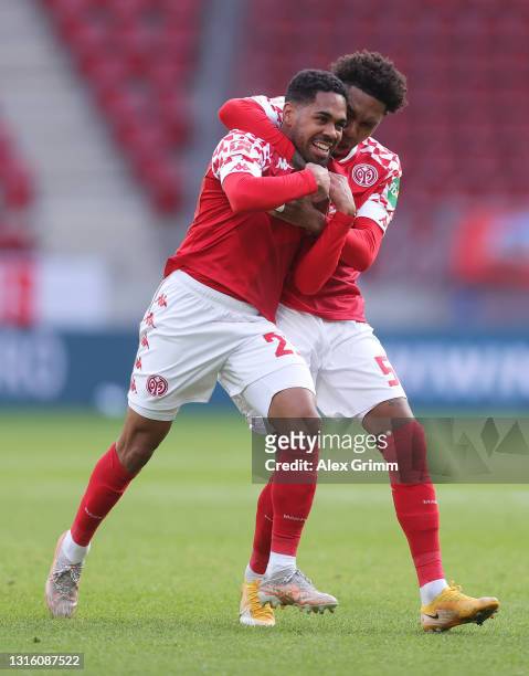Phillipp Mwene of 1. FSV Mainz 05 celebrates with Jean-Paul Boetius after scoring their side's first goal during the Bundesliga match between 1. FSV...