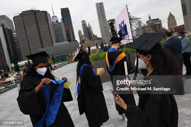 Students prepare to walk on the stage as they participate in the Seidenberg School of CSIS of Pace University graduation ceremony at South Street...