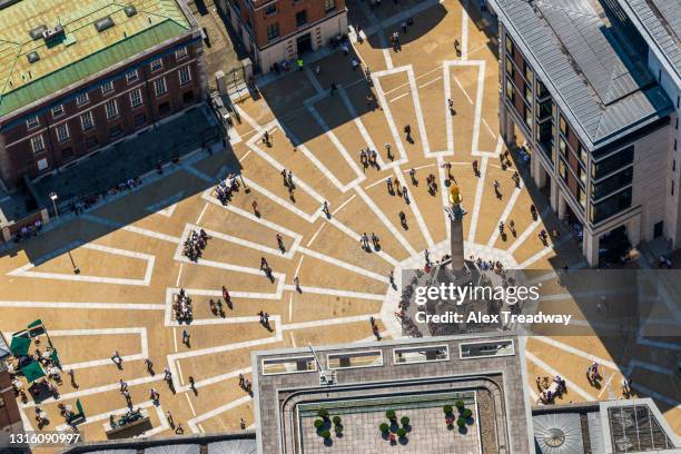 aerial view of paternoster square taken from a helicopter near st pauls cathedral in london - circular business district stock-fotos und bilder
