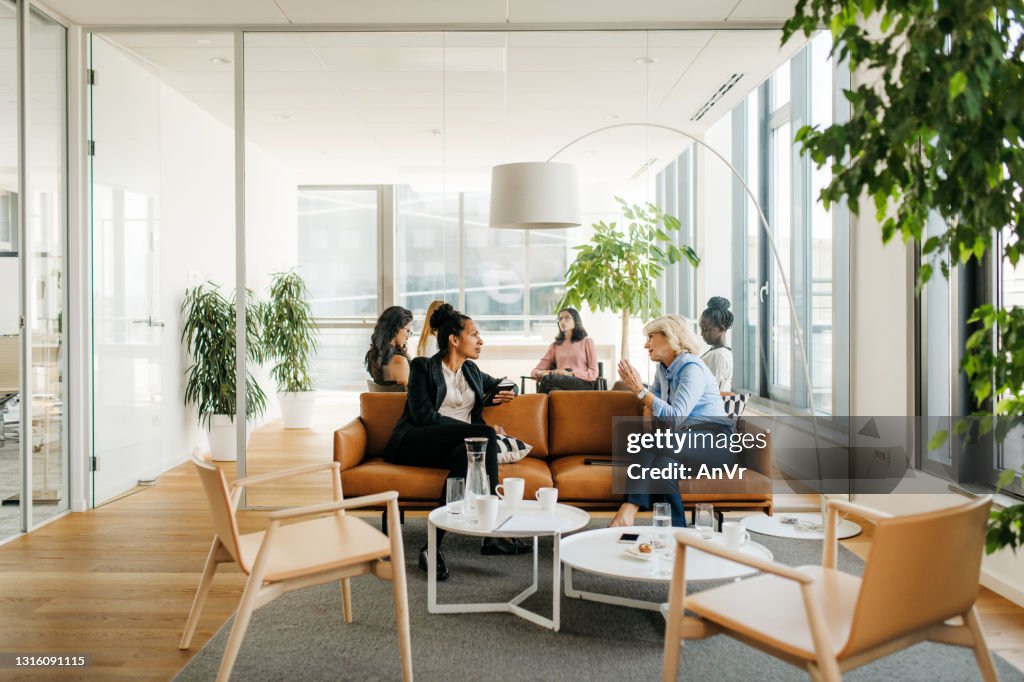 Female colleagues on a break in a modern office