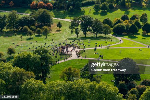 an aerial view of primrose hill next to regents park in north london with crowds of people - british culture walking stock pictures, royalty-free photos & images