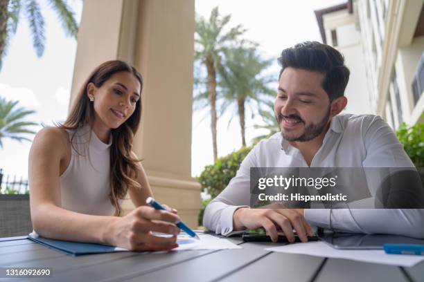 real estate agent and client talking about a contract to buy a house - deed stock pictures, royalty-free photos & images