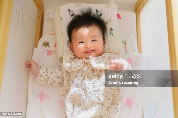 portrait of small baby - baby girls stock pictures, royalty-free photos & images
