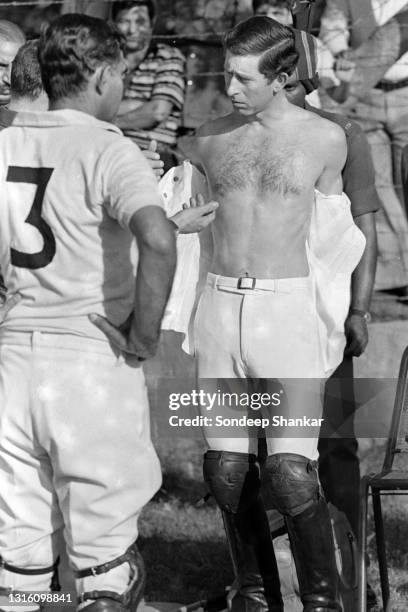 Charles, Prince of Wales, on a 13 days tour of India, changes after a game of Polo at Jaipur Polo Grounds in New Delhi, November 1980.