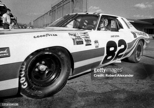 Driver Janet Guthrie departs the speedway garage and heads for the track during a practice session prior to the start of the 1980 Daytona 500 stock...