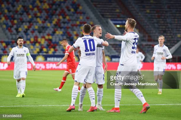 Philipp Hofmann of Karlsruher SC celebrates with Marvin Wanitzek and Marco Thiede after scoring their side's first goal during the Second Bundesliga...