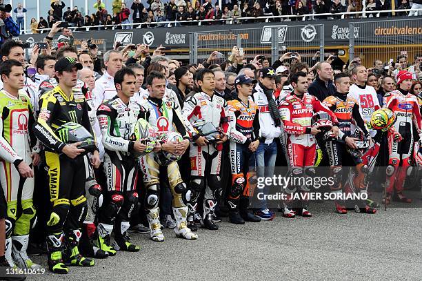 Rides from the three categories of the World Championship stand in the Pit Lane as a tribute to San Carlo Honda Gresini's Italian Marco Simoncelli...