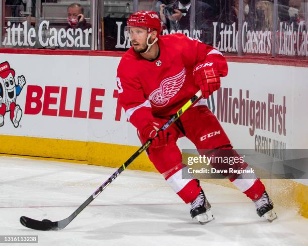 Alex Biega of the Detroit Red Wings stops behind the net against the Tampa Bay Lightning during the second period of an NHL game at Little Caesars...