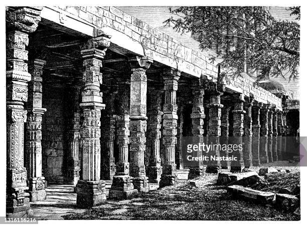 delhi – colonnade in quitab minar temple, india - sandstone stock illustrations