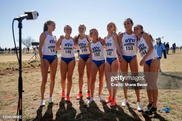 The BYU cross country team celebrates after winning the team championships during the Division I Men's and Women's Cross Country Championships held...