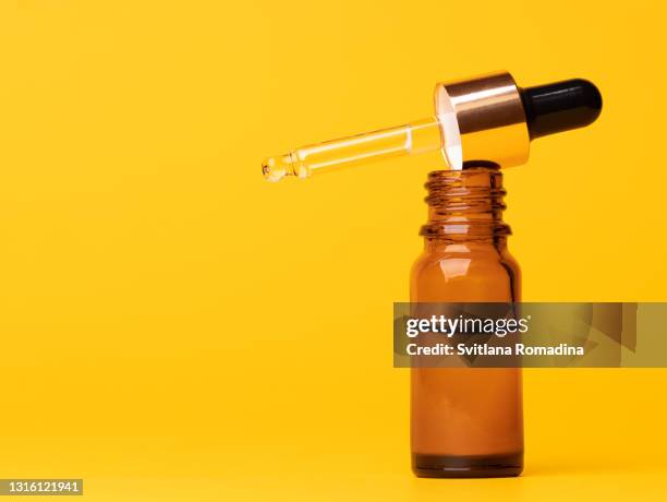 brown glass medicine  bottle with dropper - brown bottle stock pictures, royalty-free photos & images