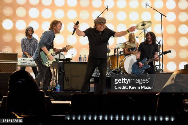 In this image released on May 2, Brian Johnson of music group AC/DC performs onstage with Chris Shiflett, Rami Jaffee, Dave Grohl, and Taylor Hawkins...