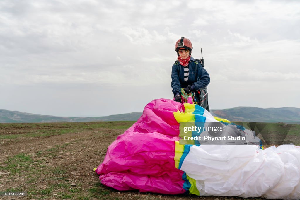 Woman carrying her parachute