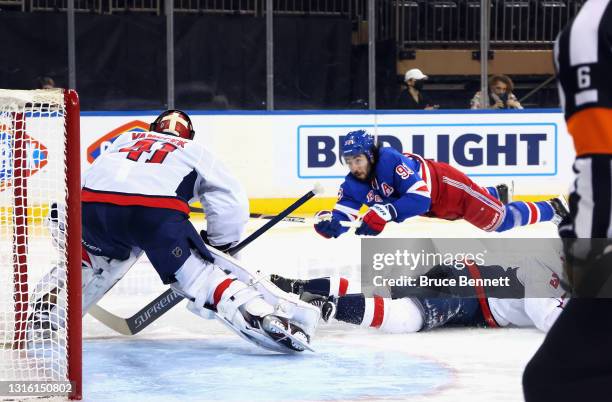 Mika Zibanejad of the New York Rangers takes the first period shot against Vitek Vanecek of the Washington Capitals at Madison Square Garden on May...