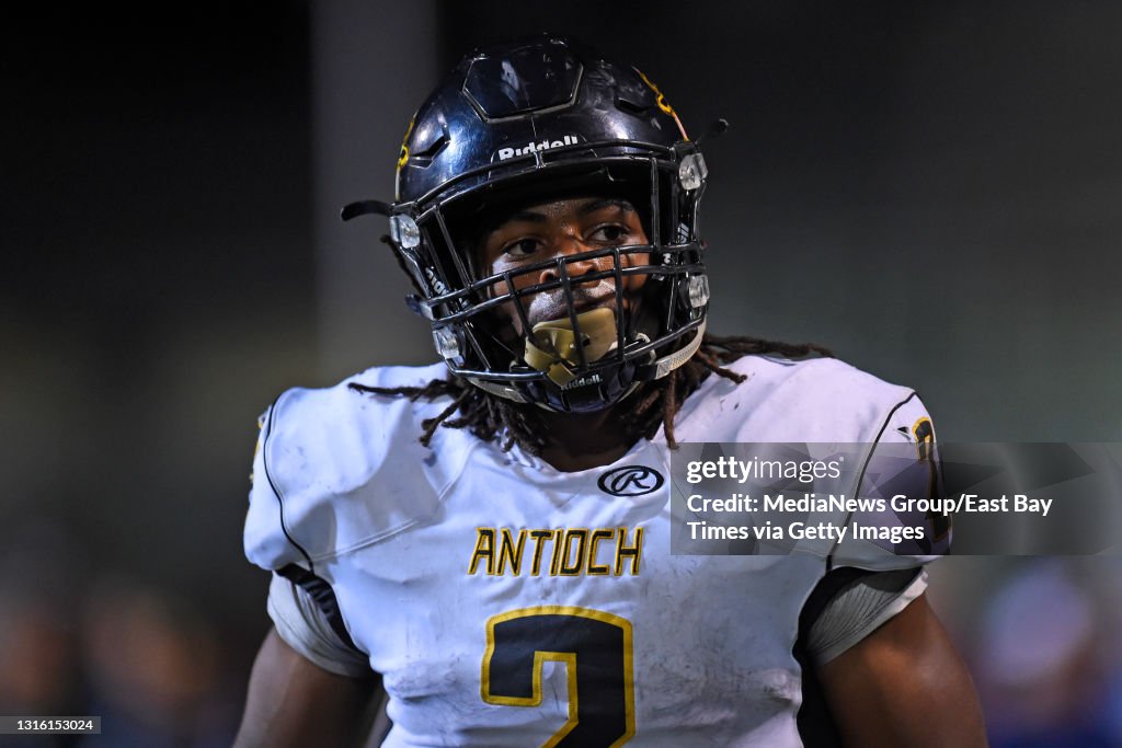 Antioch High School's Najee Harris walks on the field while playing