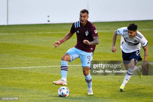 Andre Shinyashiki of Colorado Rapids drives past Russell Teibert of Vancouver Whitecaps during a game at Rio Tinto Stadium on May 02, 2021 in Sandy,...