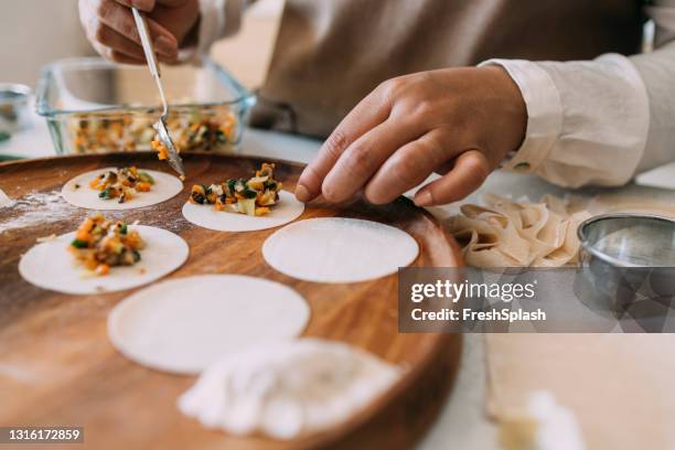 step by step guidetutorial - how to prepare homemade dumplings from scratch - chocolate wrapper stock pictures, royalty-free photos & images