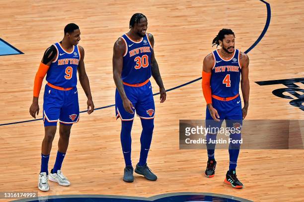 Barrett, Julius Randle and Derrick Rose of the New York Knicks walk on the court during the second half against the Memphis Grizzlies at FedExForum...
