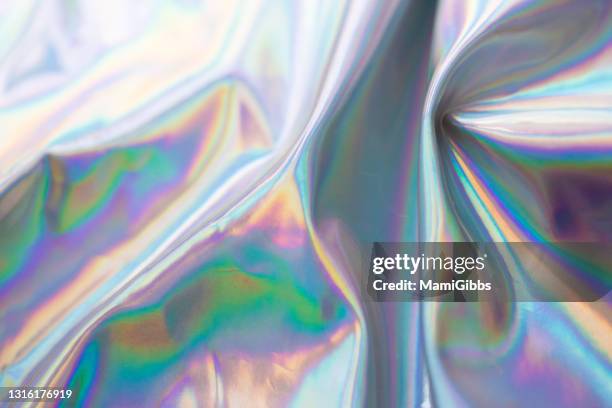 glass on the hologram rainbow color cloth - holographic foil stock pictures, royalty-free photos & images