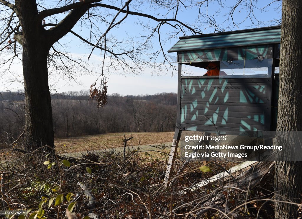 Wade Wetzel a disabled hunter in Greenwich Township deer hunting on his family's farm. Wade uses an ATV to travel to a hunting blind constructed from garage door panels. 11/28/16 photo by Tim Leedy