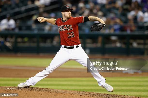 Relief pitcher Chris Devenski of the Arizona Diamondbacks pitches against the Colorado Rockies during the MLB game at Chase Field on May 02, 2021 in...