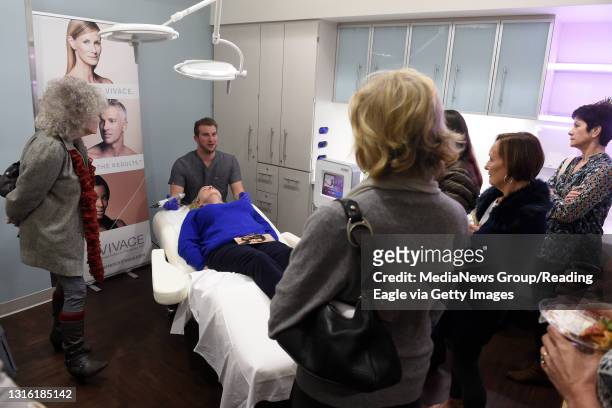 Attendees get a lesson in Vivace microneedling during an open house at the newly renovated Tower Health Plastic Surgery and MedSpa in Spring Township...