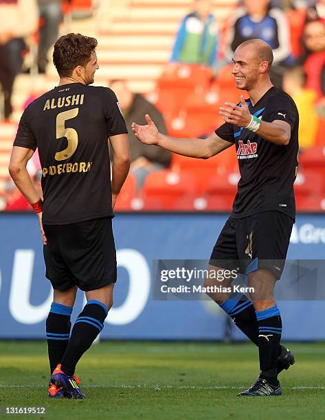 Daniel Brueckner of Paderborn jubilates with team mate Enis Alushi after scoring the first goal during the Second Bundesliga match between FC Energie...