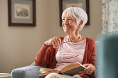 Happy senior woman smiling at home
