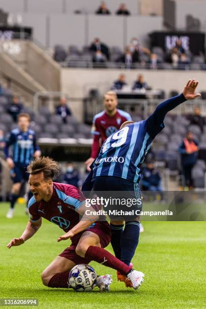 Eric Larsson of Malmo FF fouled by Nicklas Barkroth of Djurgardens IF during the Allsvenskan match between Djurgardens IF and Malmo FF at Tele2 Arena...