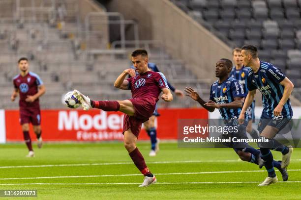Jonas Knudsen of Malmo FF clears the ball away to break up a Djurgardens IF attack during the Allsvenskan match between Djurgardens IF and Malmo FF...