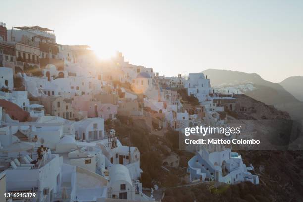 first light over the greek town of oia santorini greece - oia santorini bildbanksfoton och bilder