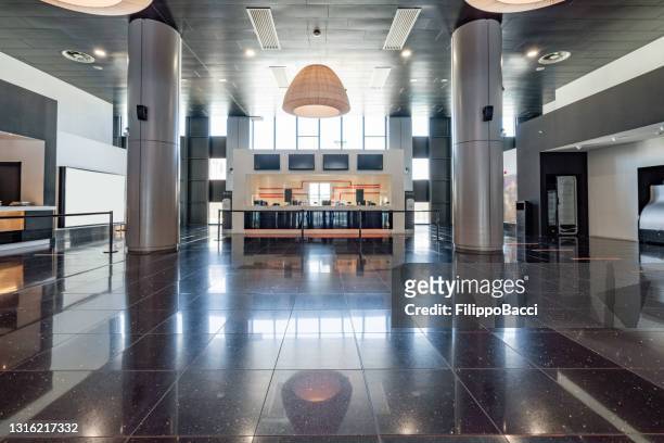 wide angle shot of a modern movie theater lobby - cinema interior stock pictures, royalty-free photos & images
