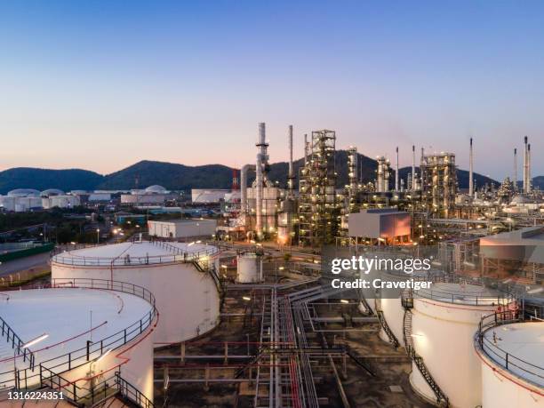 the oil refining and petrochemical industries plant in twilight time. - steam power stock pictures, royalty-free photos & images