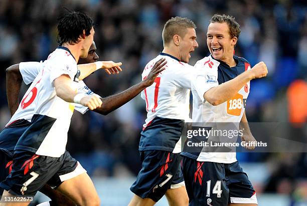 Kevin Davies of Bolton Wanderers celebrates with his team mates after scoring the opening goal during the Barclays Premier League match between...