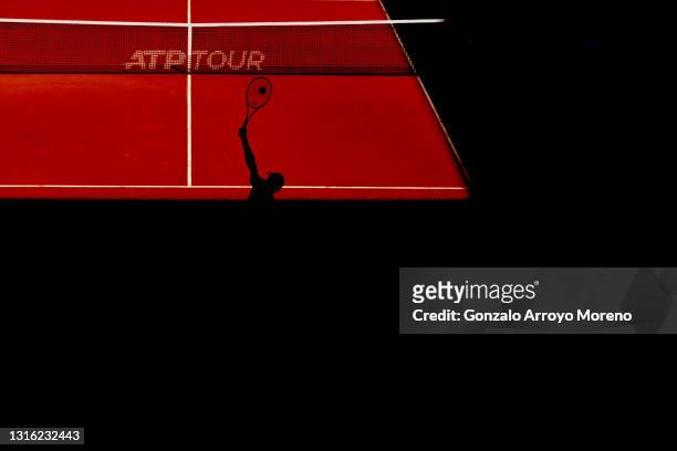Guido Pella of Argentina serves in his mens singles match against Jannik Sinner of Italy during day six of the Mutua Madrid Open at La Caja Magica on...