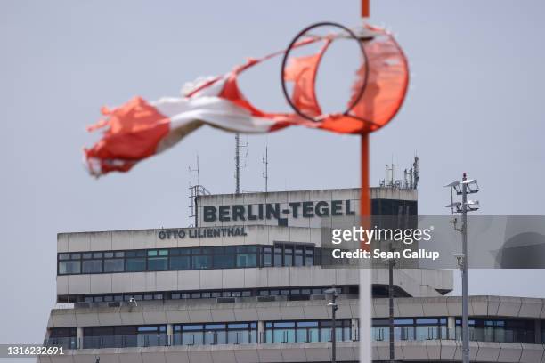Wind sock flutters at former Tegel Airport on May 04, 2021 in Berlin, Germany. Tegel Airport, which closed to flight traffic on November 8 of last...