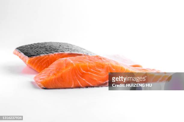 fresh raw salmon fillets isolated on white background. - salmon seafood stock pictures, royalty-free photos & images