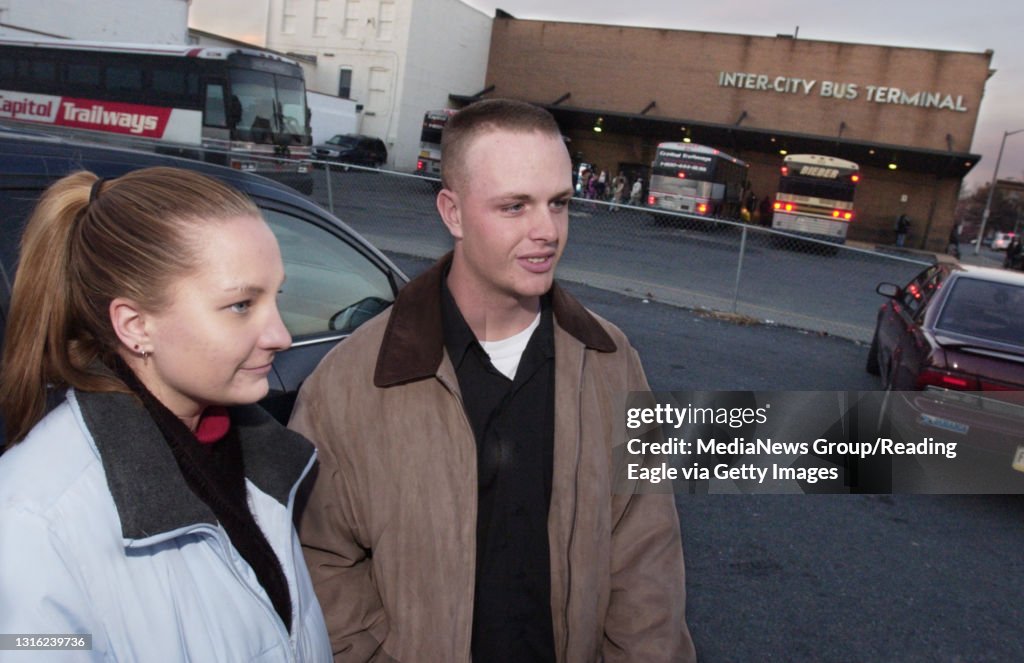 Reading,PA 12/22/04- Tyler B. Lewis,20 (right) and his girlfriend Malia S. Underhil,19, both of Exeter stand outside the Reading Inter-City Bus Terminal on Third st. in Reading Wed evening. They just arrived on a bus from New York City where they had been