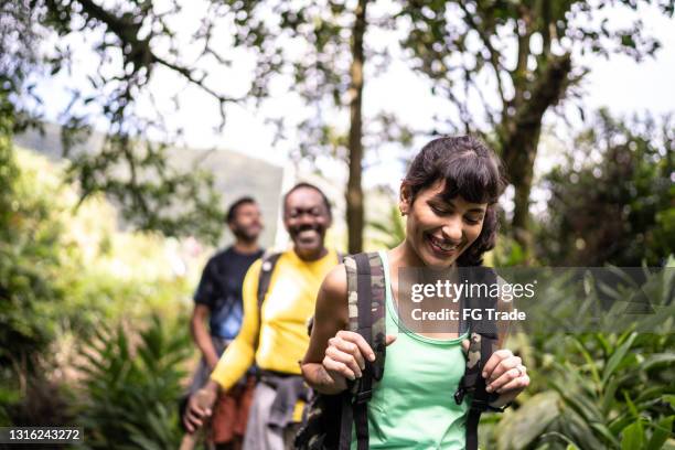 group of friends hiking together in a forest - tourism in brazil stock pictures, royalty-free photos & images