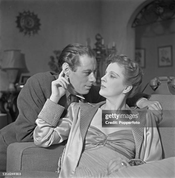 English actors Rex Harrison and Diana Wynyard play the roles of Gaylord Esterbrook and his wife Linda Page Esterbrook in a scene from the West End...