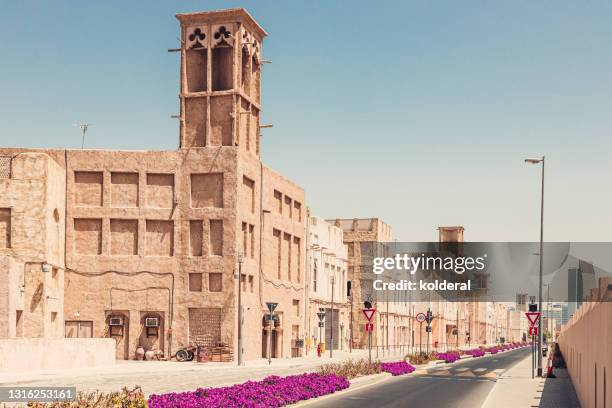 traditional architecture of renovated historic neighborhood in dubai - the past stock pictures, royalty-free photos & images