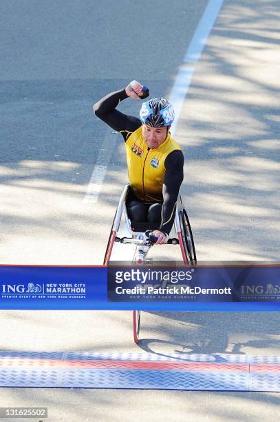 Masazumi Soejima of Japan celebrates as he finishes first in the Men's Wheelchair Division at the 42nd ING New York City Marathon in Central Park on...