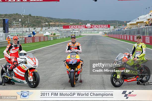 MotoGP World Champions: Stefan Bradl of Germany and Viessmann Kiefer Racing, Casey Stoner of Australia and Repsol Honda Team and Nicolas Terol of...