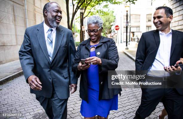 married couples walking through downtown area on a night out - atlanta georgia street stock pictures, royalty-free photos & images