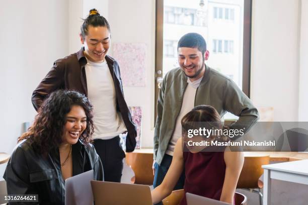 multinational group of generation z entrepreneurs communication on business meeting around the table - インド系民族 ストックフォトと画像