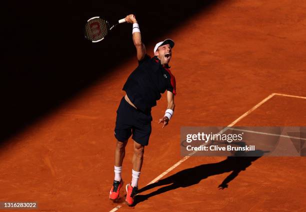 Roberto Bautista Agut of Spain serves in his mens singles match against Marco Cecchinato of Italy during day six of the Mutua Madrid Open at La Caja...